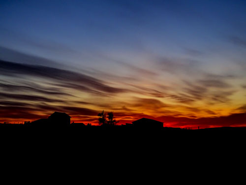 Sunset over barns